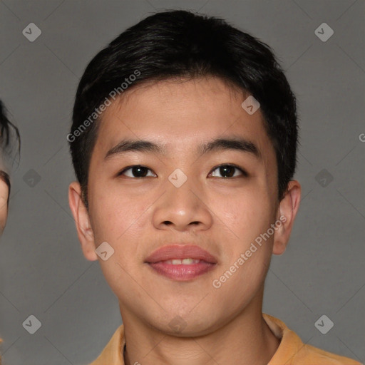 Joyful asian young-adult male with short  brown hair and brown eyes