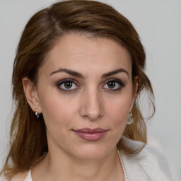 Joyful white young-adult female with medium  brown hair and brown eyes