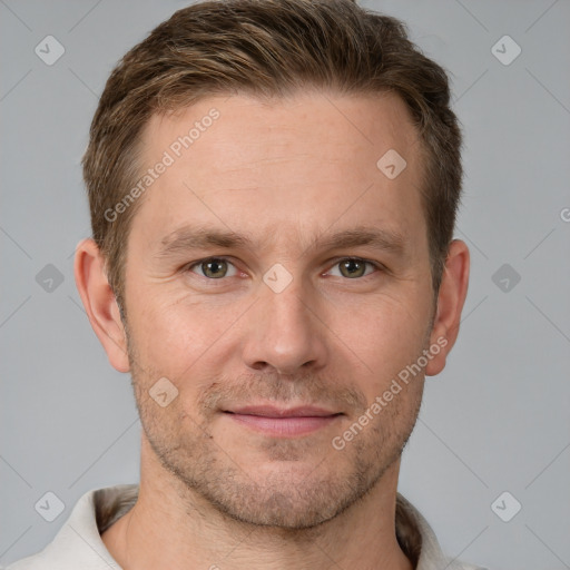 Joyful white adult male with short  brown hair and grey eyes