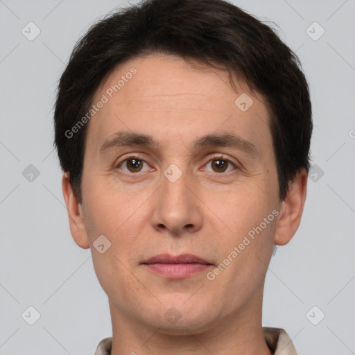 Joyful white adult male with short  brown hair and brown eyes