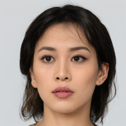 Neutral asian young-adult female with medium  brown hair and brown eyes