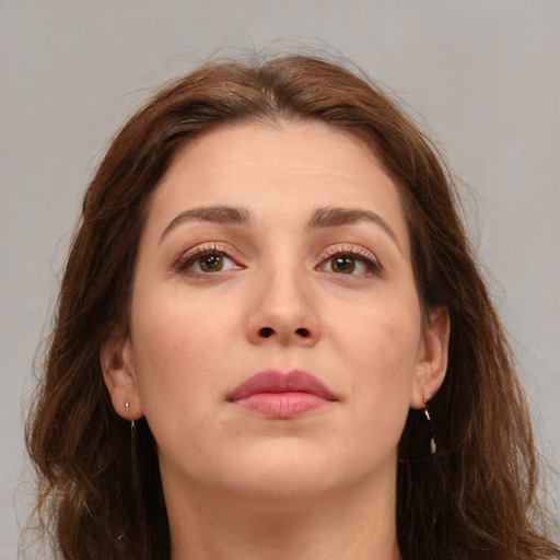 Neutral white young-adult female with long  brown hair and brown eyes