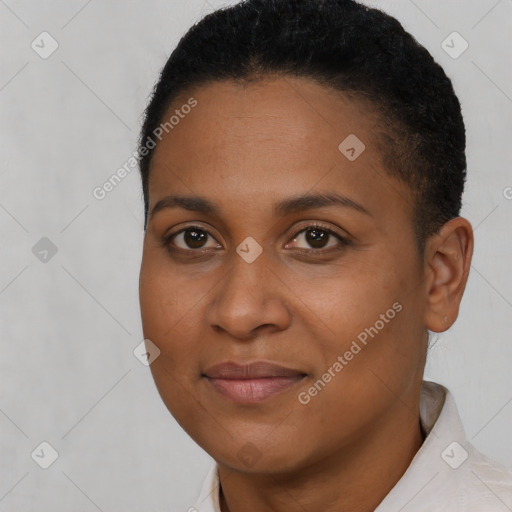 Joyful black young-adult female with short  brown hair and brown eyes