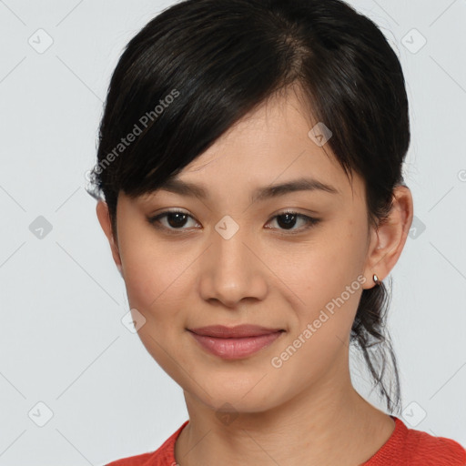 Joyful asian young-adult female with medium  black hair and brown eyes