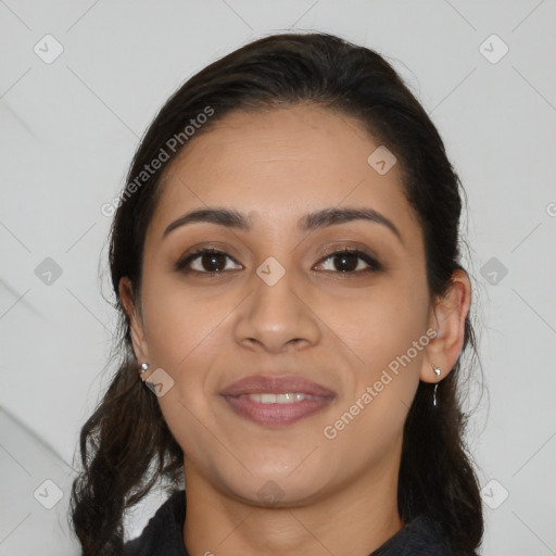 Joyful latino young-adult female with medium  brown hair and brown eyes