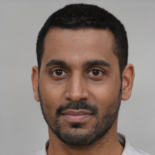 Neutral black young-adult male with short  black hair and brown eyes