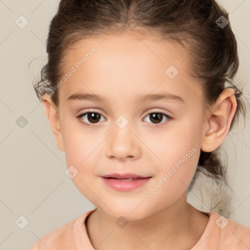 Joyful white child female with short  brown hair and brown eyes