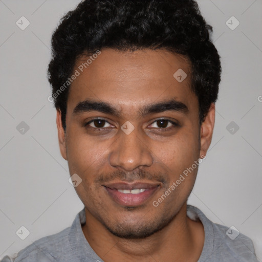 Joyful black young-adult male with short  black hair and brown eyes