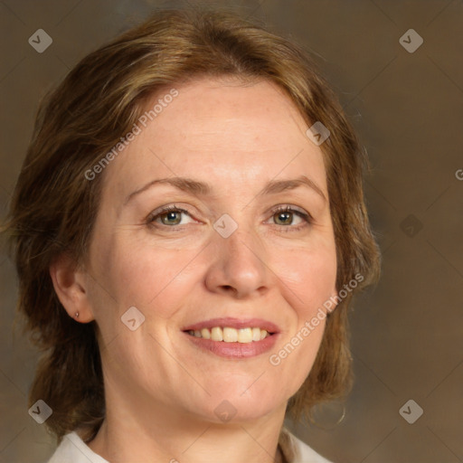 Joyful white adult female with medium  brown hair and green eyes