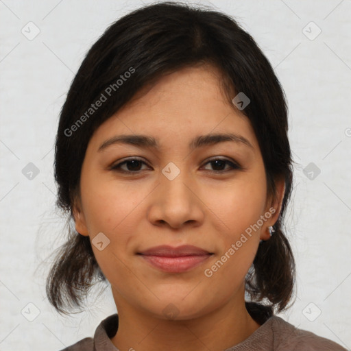 Joyful latino young-adult female with medium  brown hair and brown eyes