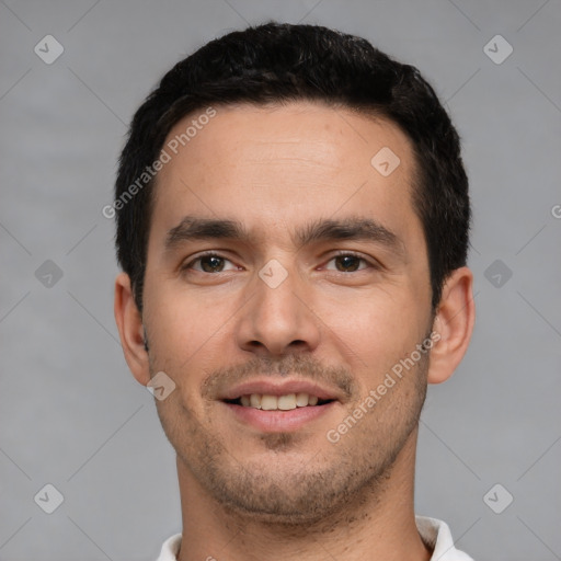 Joyful white young-adult male with short  black hair and brown eyes