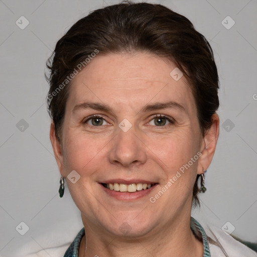 Joyful white adult female with short  brown hair and grey eyes