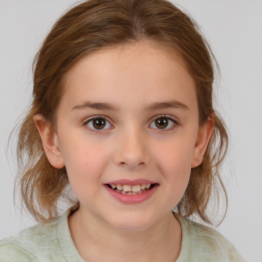 Joyful white child female with medium  brown hair and brown eyes