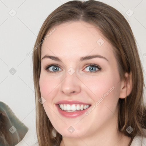 Joyful white young-adult female with medium  brown hair and green eyes