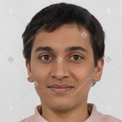 Joyful latino young-adult male with short  brown hair and brown eyes