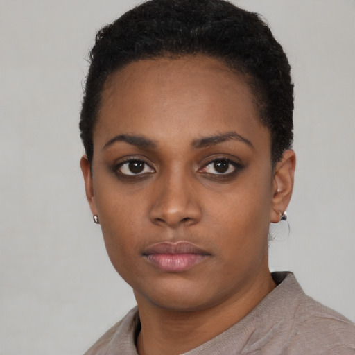 Neutral black young-adult female with short  black hair and brown eyes