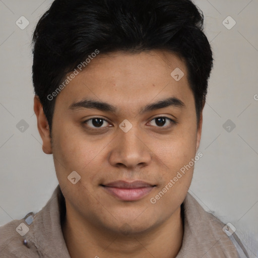 Joyful latino young-adult male with short  brown hair and brown eyes