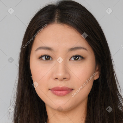 Joyful asian young-adult female with long  brown hair and brown eyes