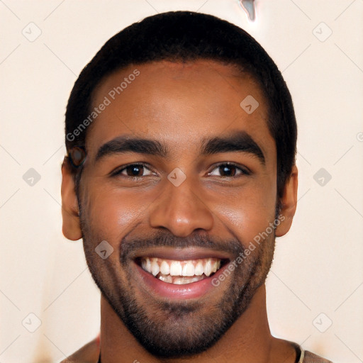 Joyful black young-adult male with short  black hair and brown eyes