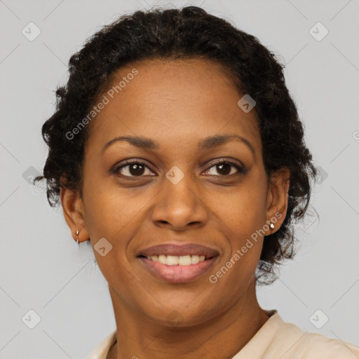 Joyful black adult female with short  brown hair and brown eyes