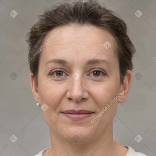 Joyful white adult female with short  brown hair and brown eyes