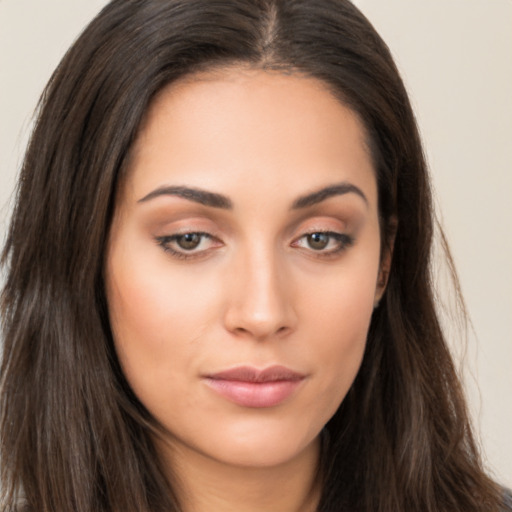 Joyful asian young-adult female with long  brown hair and brown eyes