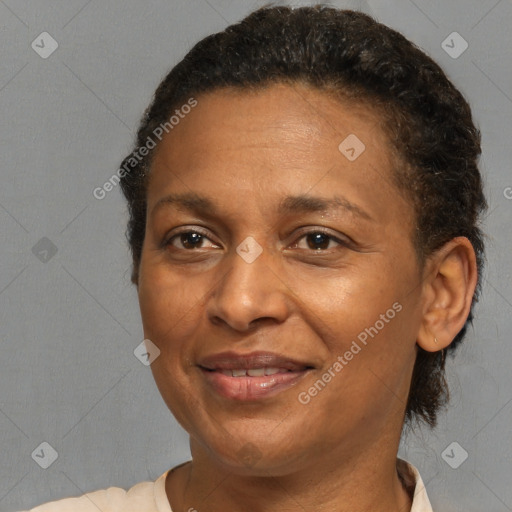 Joyful black adult female with short  brown hair and brown eyes