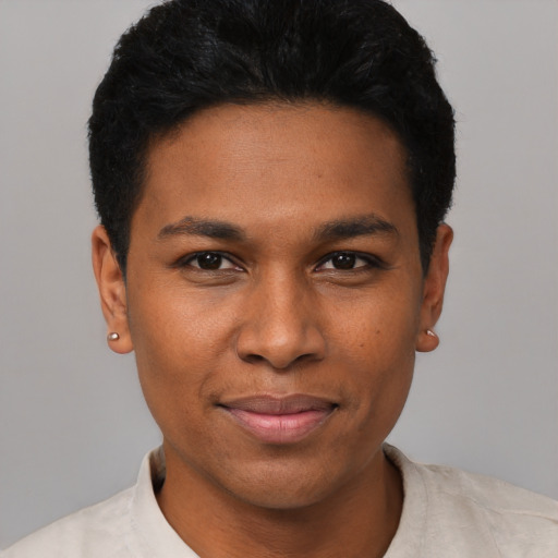 Joyful black young-adult male with short  black hair and brown eyes