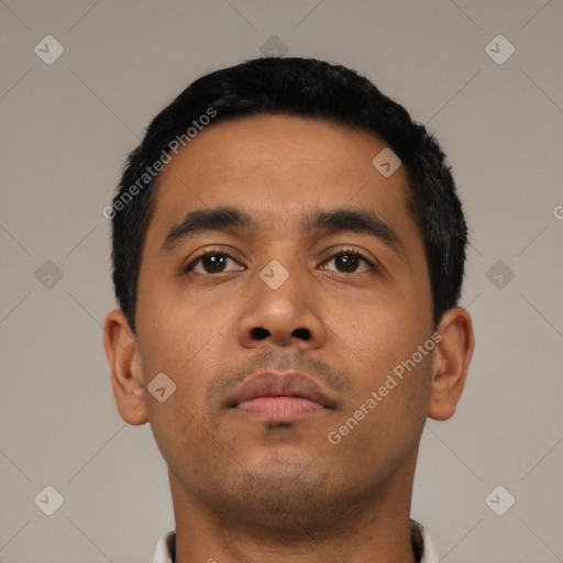 Neutral latino young-adult male with short  black hair and brown eyes