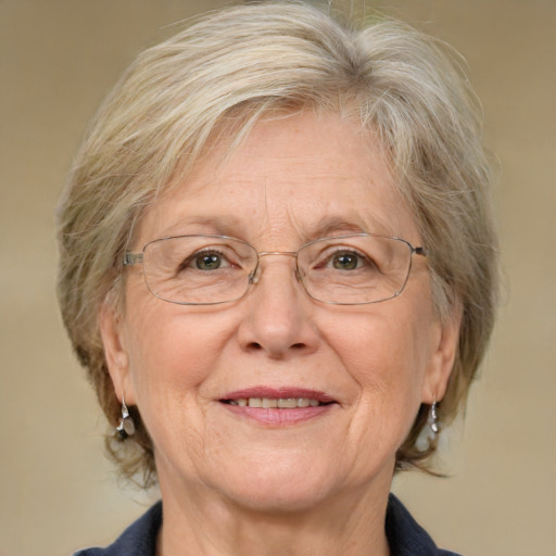 Joyful white middle-aged female with medium  gray hair and blue eyes