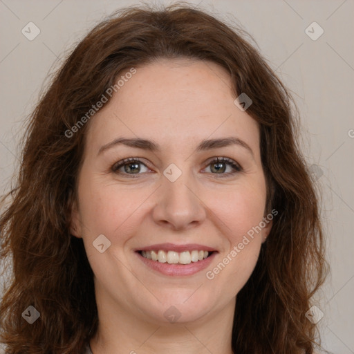 Joyful white young-adult female with long  brown hair and green eyes