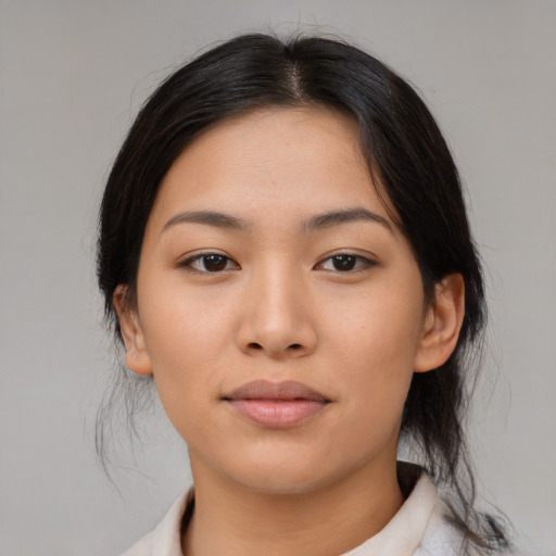 Neutral asian young-adult female with medium  brown hair and brown eyes