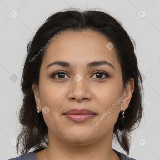 Joyful latino young-adult female with medium  brown hair and brown eyes