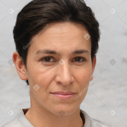 Joyful white adult female with short  brown hair and brown eyes