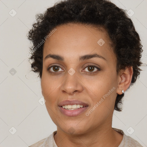 Joyful black young-adult female with short  brown hair and brown eyes