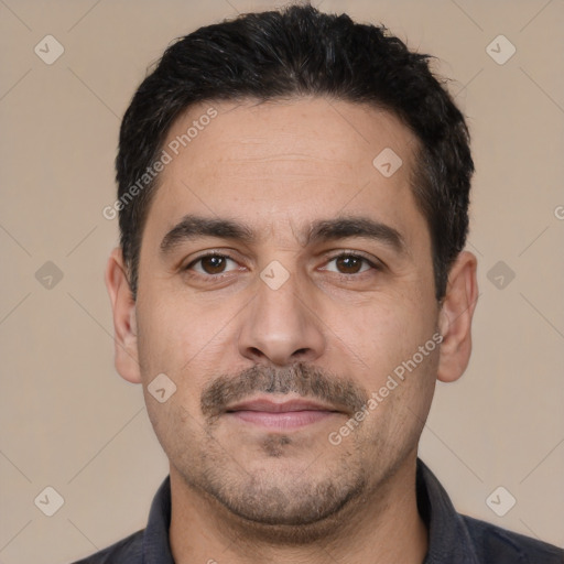 Joyful white young-adult male with short  black hair and brown eyes