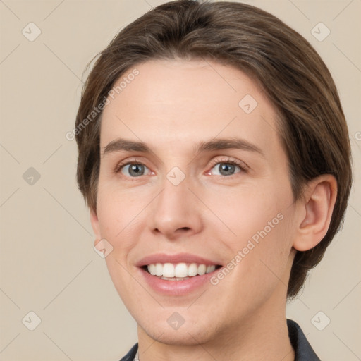 Joyful white young-adult female with medium  brown hair and grey eyes