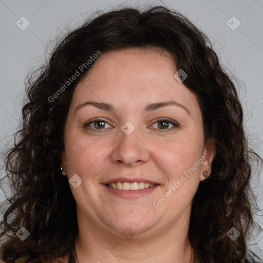 Joyful white adult female with long  brown hair and brown eyes