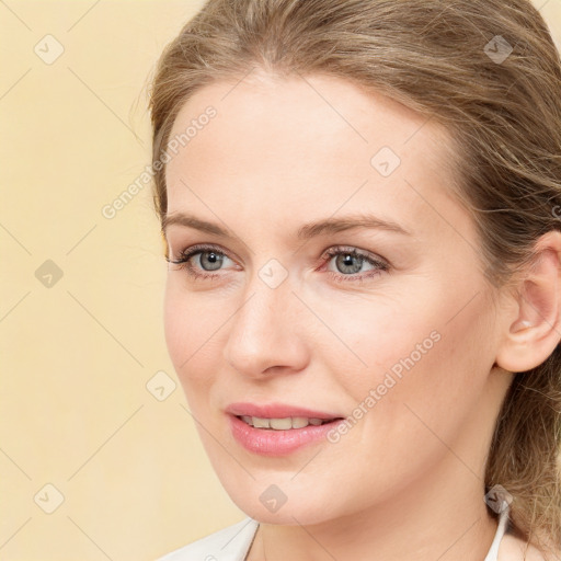 Joyful white young-adult female with long  brown hair and blue eyes