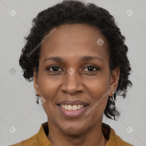 Joyful black adult female with short  brown hair and brown eyes