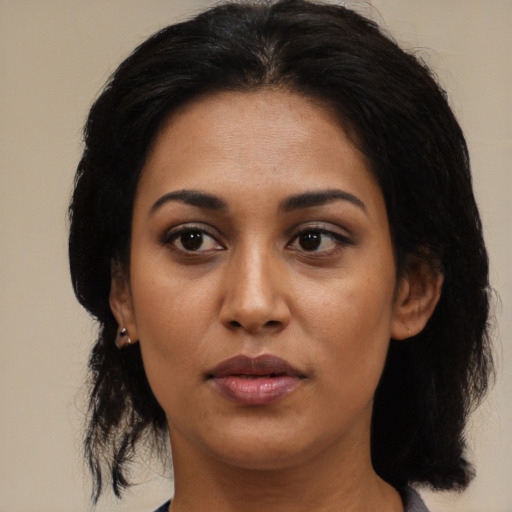 Neutral latino young-adult female with medium  black hair and brown eyes