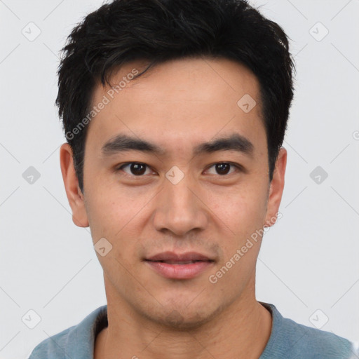 Joyful asian young-adult male with short  black hair and brown eyes