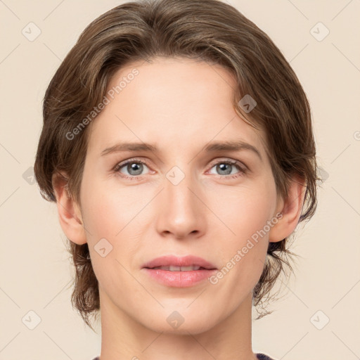 Joyful white young-adult female with medium  brown hair and green eyes