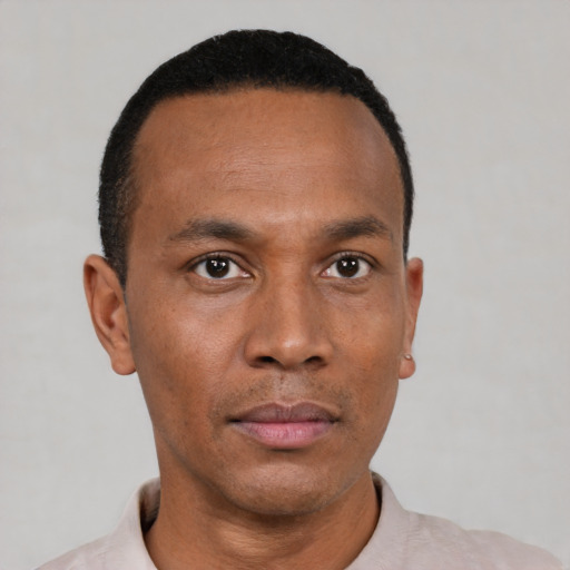 Neutral black young-adult male with short  black hair and brown eyes