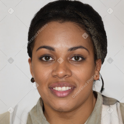 Joyful black young-adult female with short  black hair and brown eyes