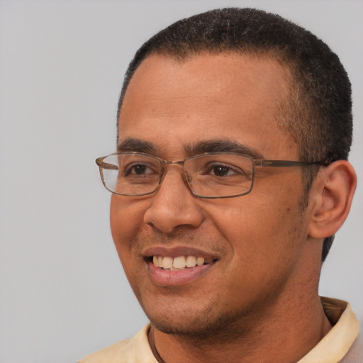 Joyful white adult male with short  black hair and brown eyes