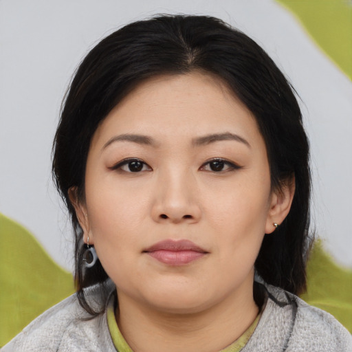 Neutral asian young-adult female with medium  black hair and brown eyes