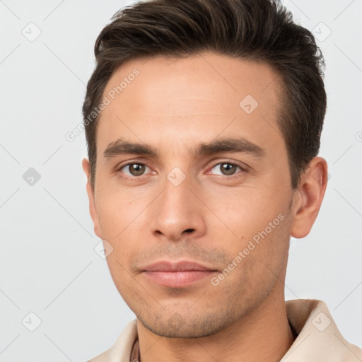 Neutral white young-adult male with short  brown hair and brown eyes