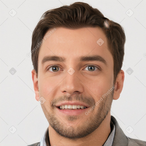 Joyful white young-adult male with short  brown hair and grey eyes