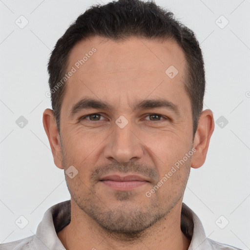 Joyful white adult male with short  brown hair and brown eyes